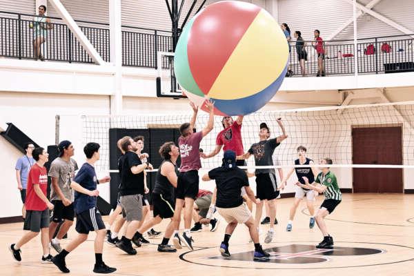 BCYC students playing volleyball with a giant beachball