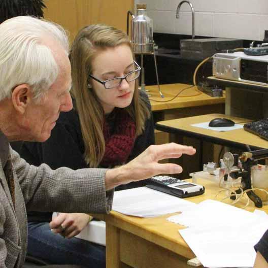 Dr. Doug Brothers assists a student in lab