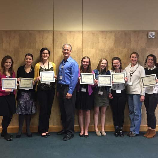 Students pose with certificates